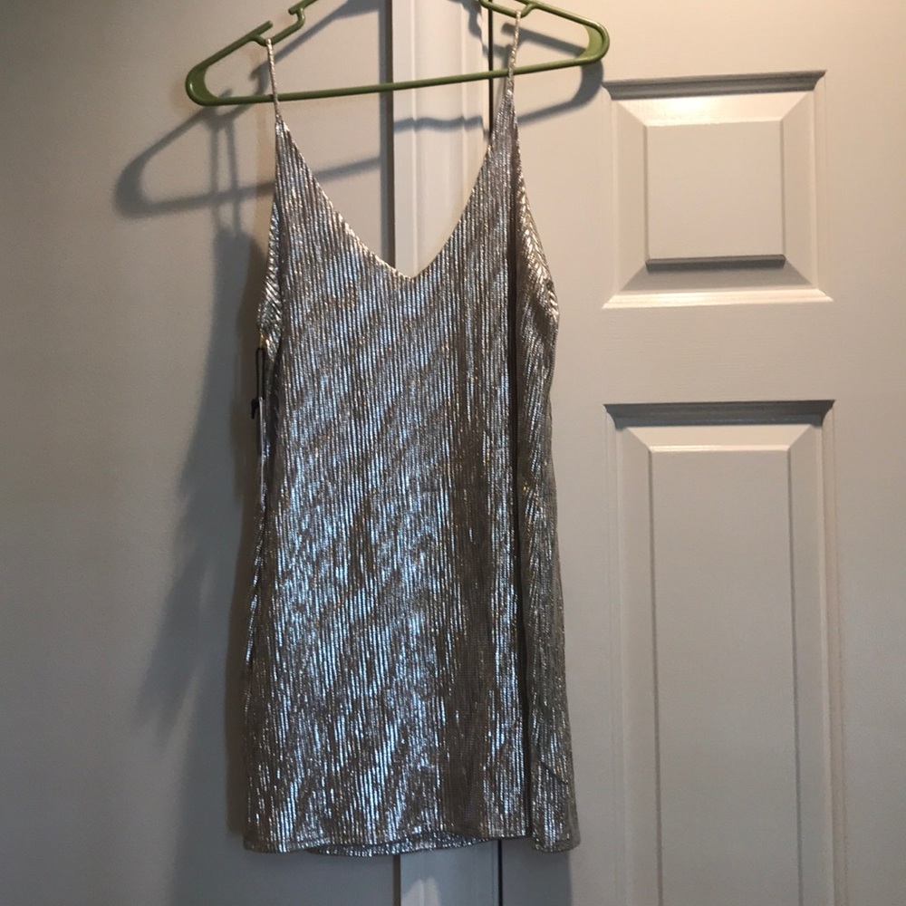 Never worn, cleaning out closet
